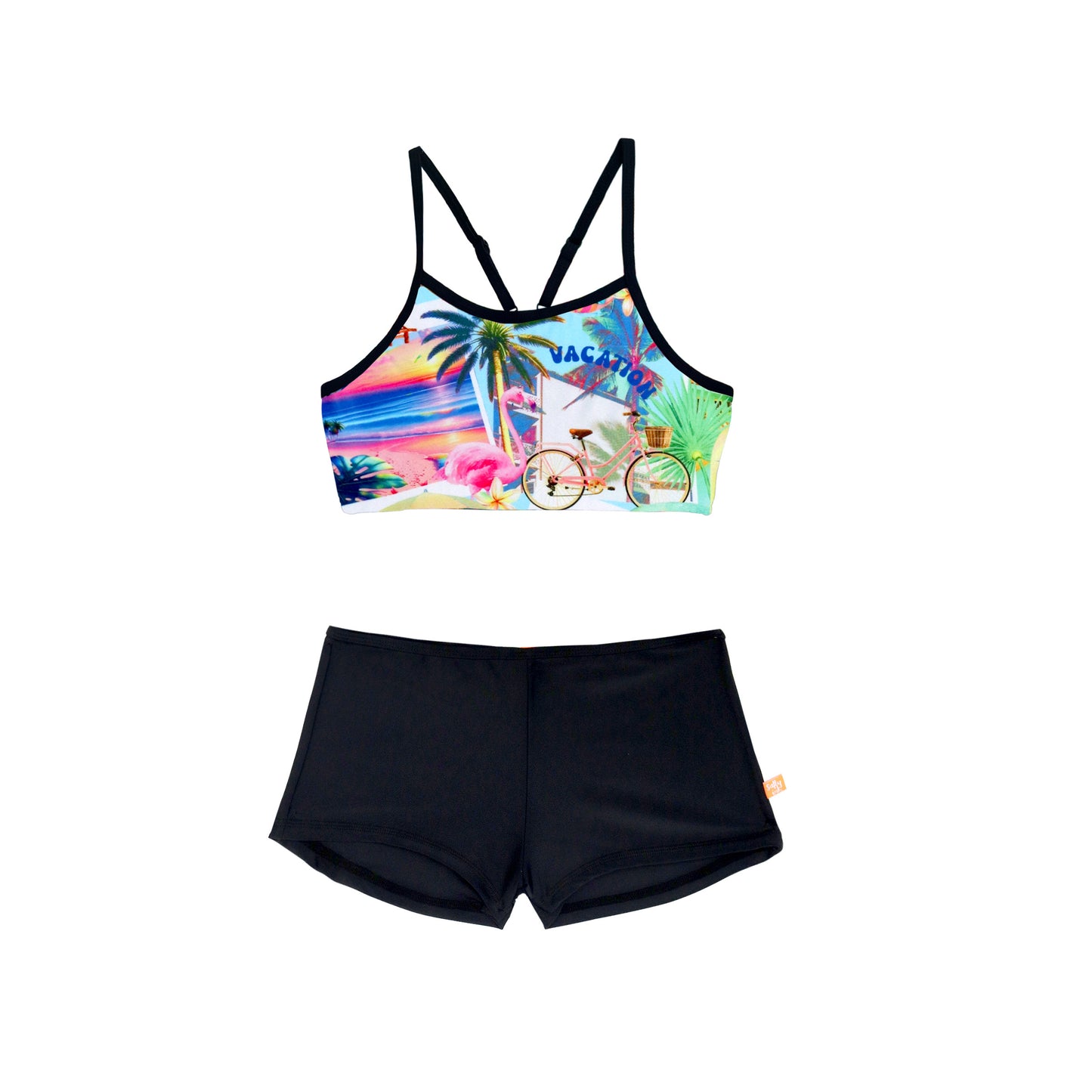 Colorful bikini top with tropical design and black shorts on a white background