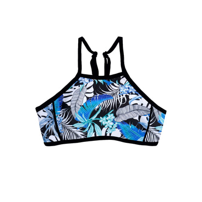 Tropical leaf patterned sports bra on a white background
